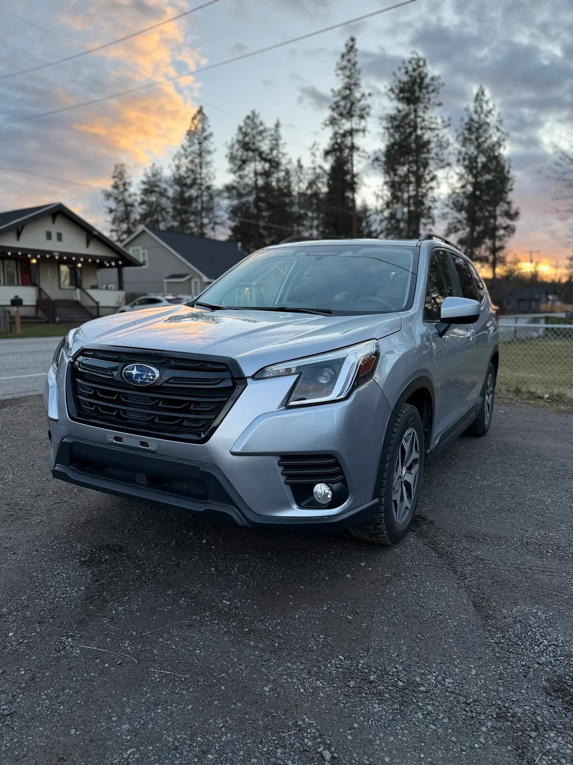 Silver Subaru Forester after repair at sunset