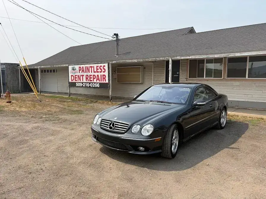 Dark grey Mercedes-Benz CL coupe after paint, polishing and ceramic coating outside the Picasso Dent Repair shop