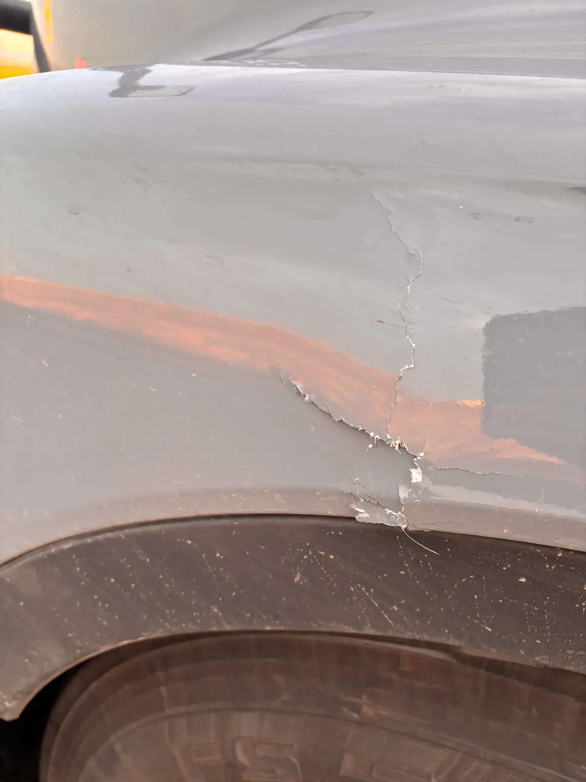 Before — cracked, peeling paint on fender